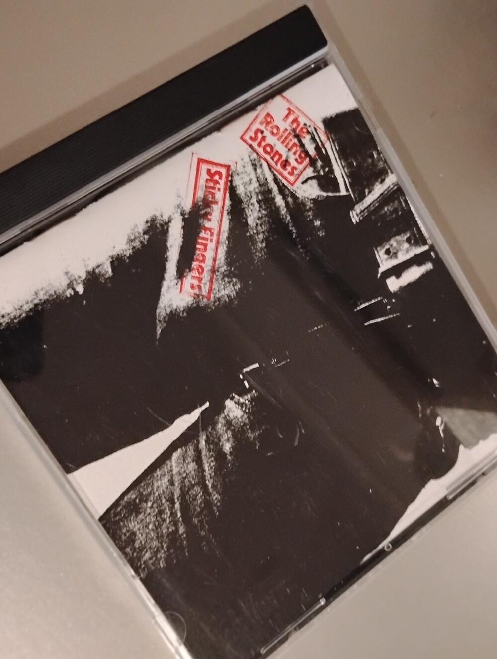 The Rolling Stones Sticky Fingers CD - Black & White Artwork with Red Logo